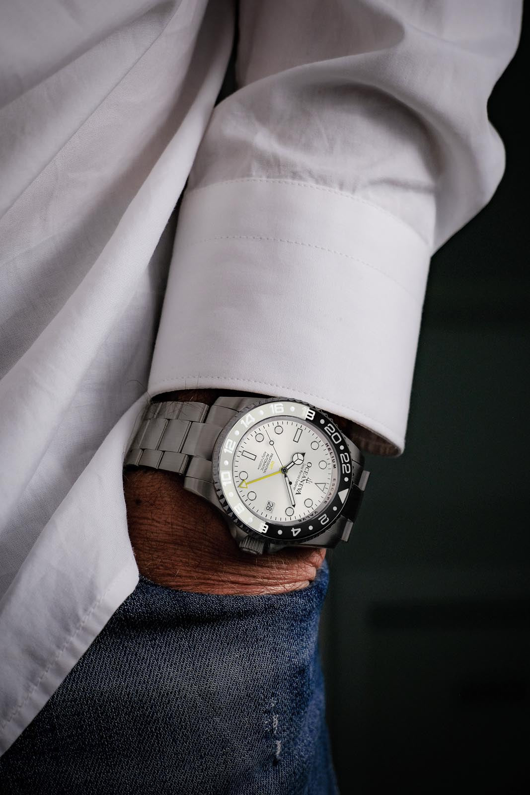 Elegant Oceaneva Titanium GMT Watch with black and white ceramic bezel on wrist