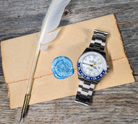 Thumbnail for Oceaneva titanium dive watch blue and white with quill, parchment and wax seal