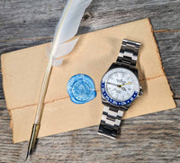 Thumbnail for Oceaneva titanium dive watch blue and white with quill, parchment and wax seal