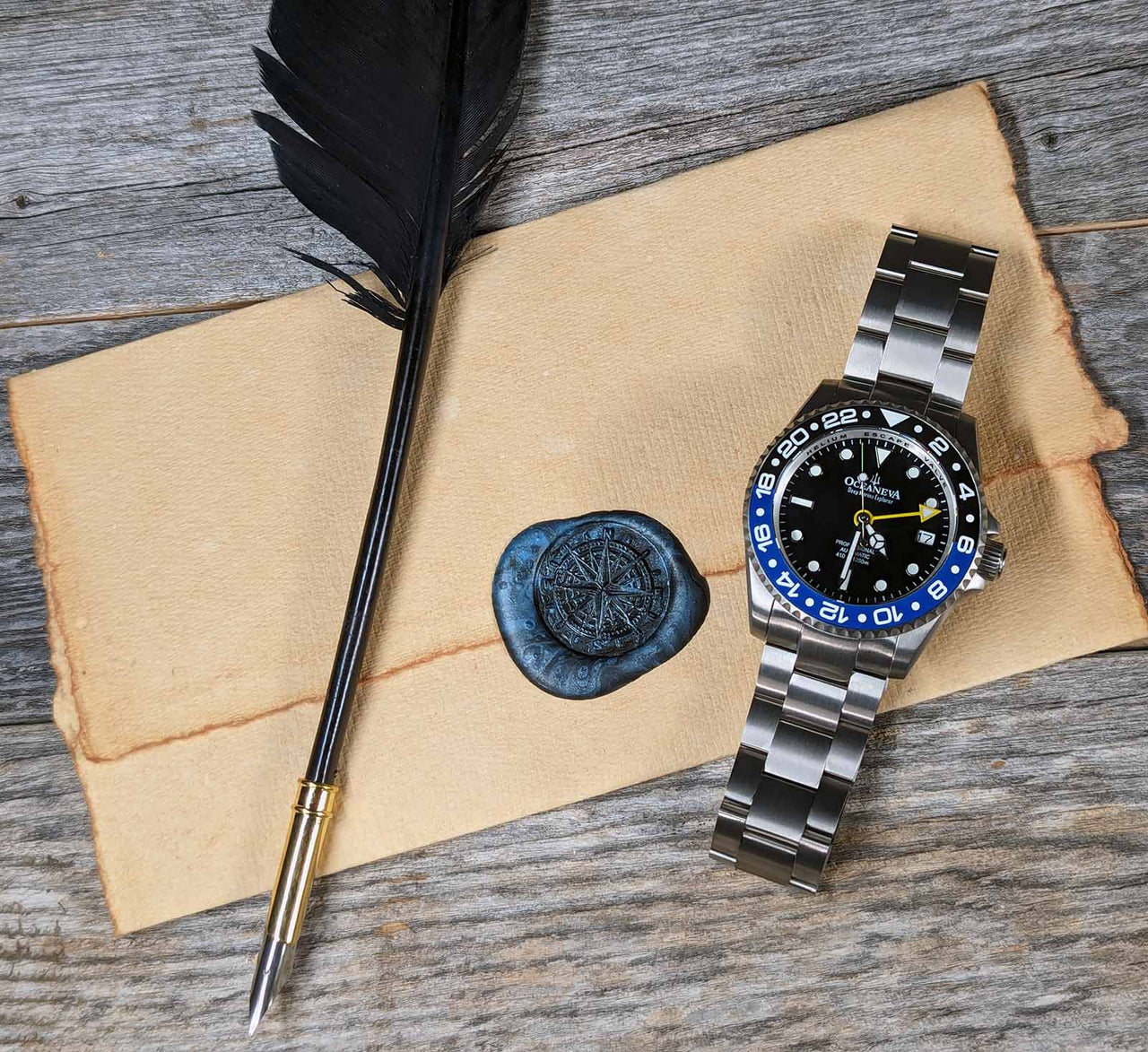 Oceaneva titanium dive watch black and blue with quill, parchment and wax seal
