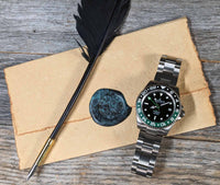 Thumbnail for Oceaneva titanium dive watch black and green with quill, parchment and wax seal