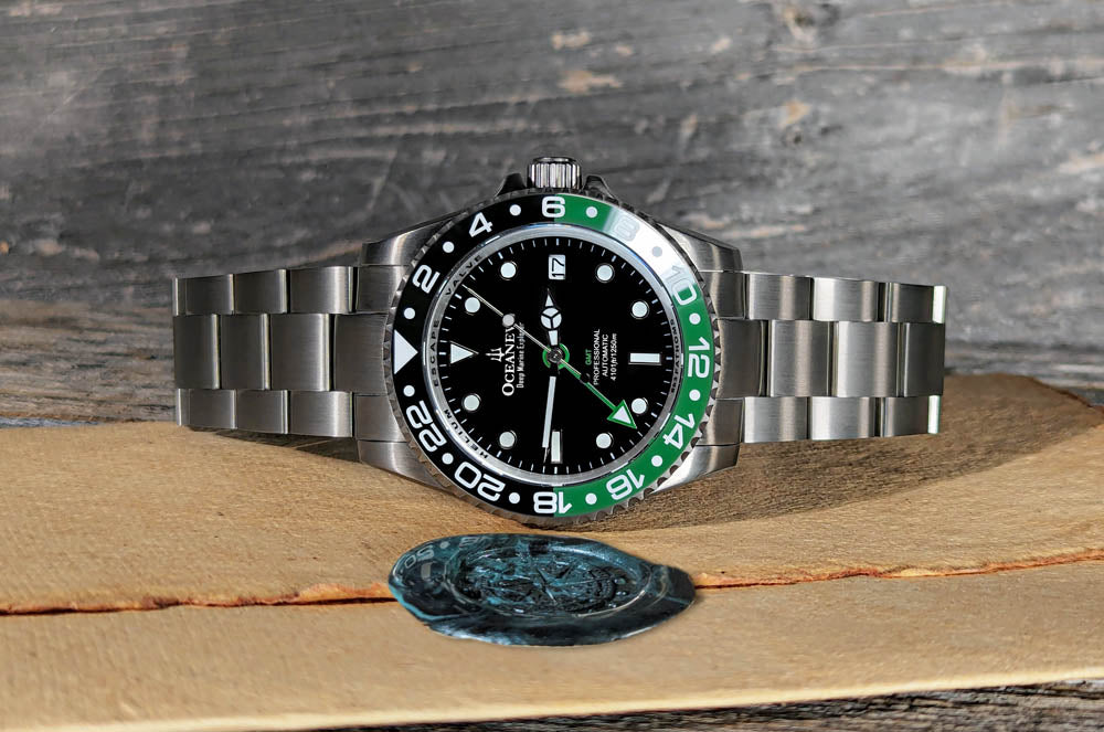 Elegant Oceaneva Titanium GMT Watch with black and green ceramic bezel