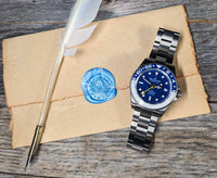 Thumbnail for Oceaneva titanium dive watch white and blue with quill, parchment and wax seal
