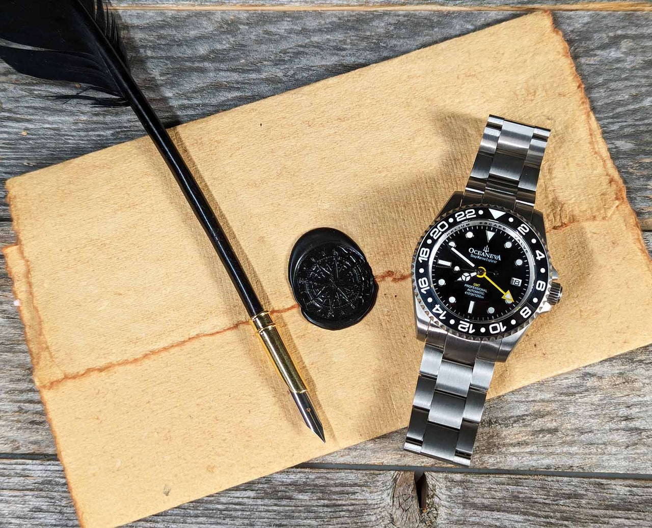 Oceaneva titanium dive watch in black with quill, parchment and wax seal