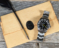 Thumbnail for Oceaneva titanium dive watch in black with quill, parchment and wax seal
