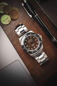 Thumbnail for Oceaneva 1250M Dive Watch Black Bezel Brown Dial On Bracelet Wooden Table