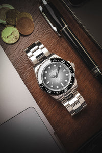 Thumbnail for Oceaneva 1250M Dive Watch Gray Fade On Bracelet Wooden Table
