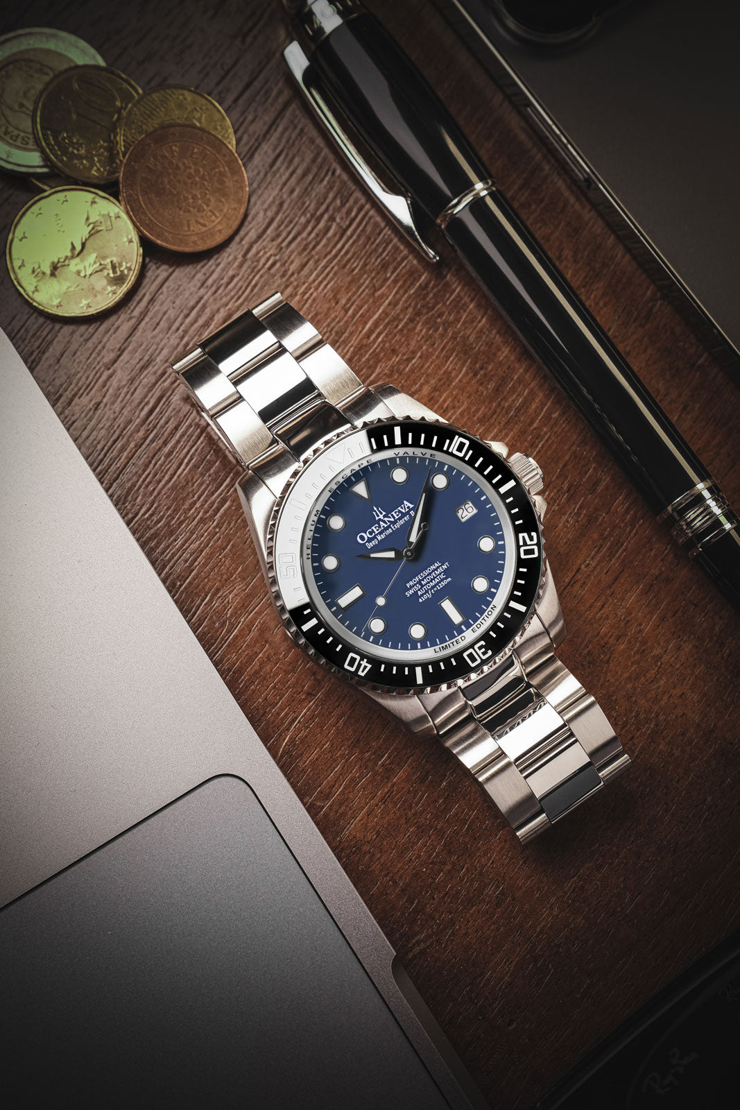 Oceaneva 1250M Dive Watch Navy Blue On Bracelet Wooden Table
