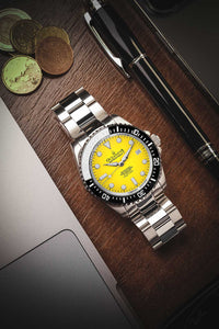 Thumbnail for Oceaneva 1250M Dive Watch Yellow On Bracelet Wooden Table