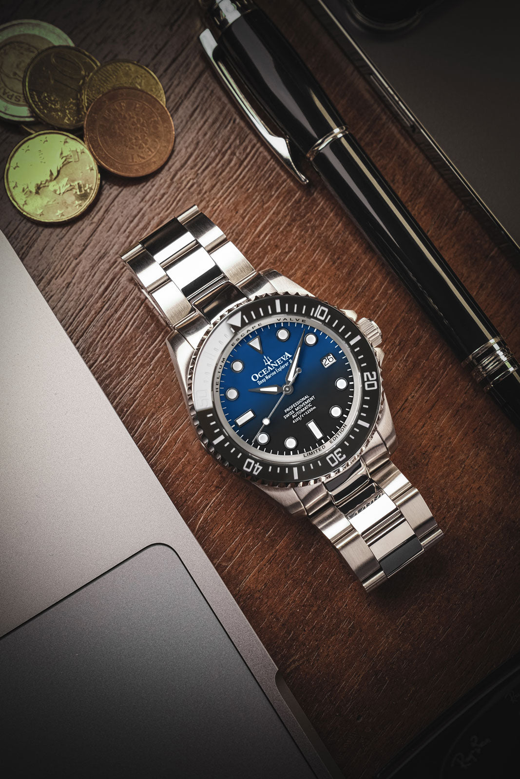 Oceaneva 1250M Dive Watch Blue Black On Bracelet Wooden Table