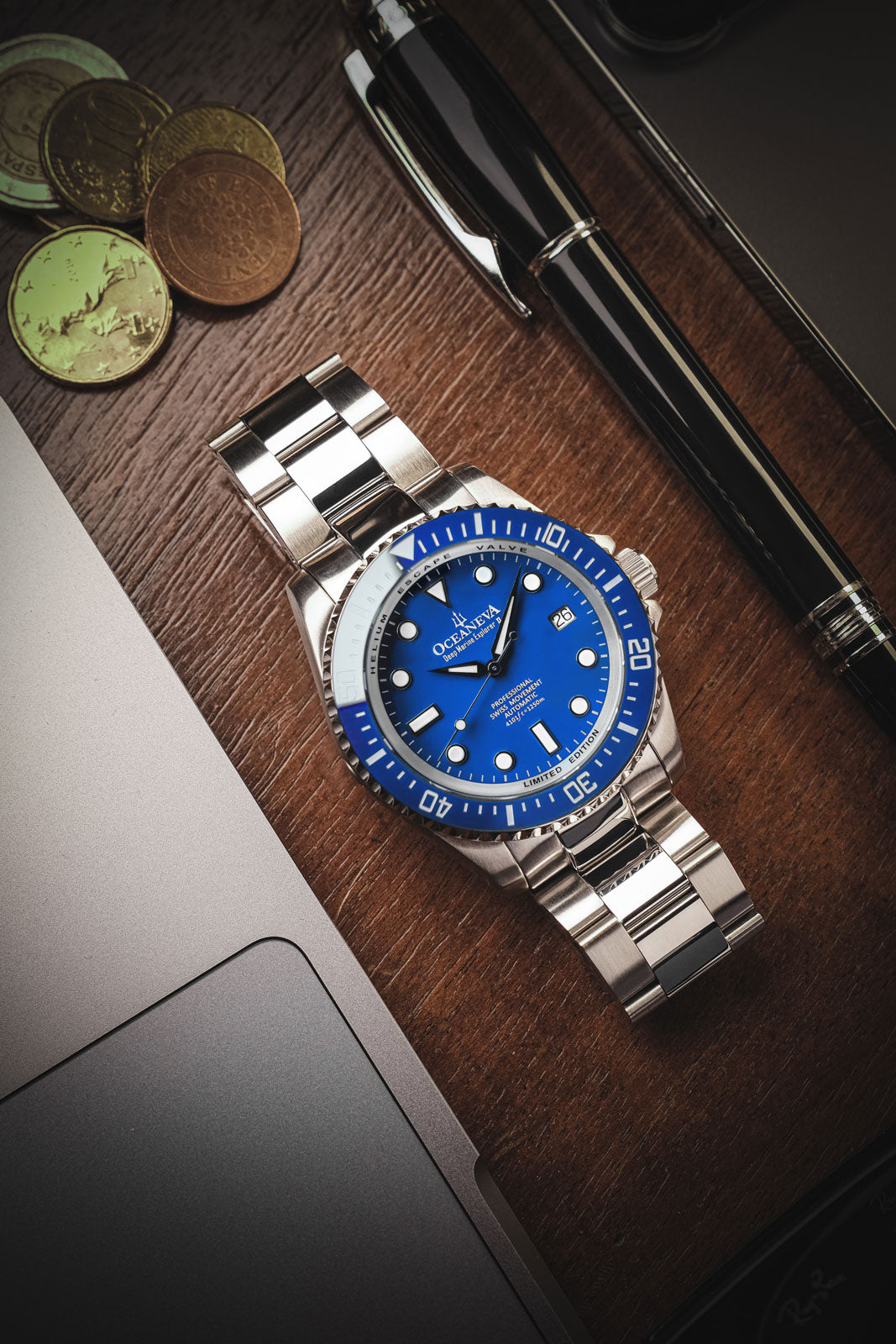Oceaneva 1250M Dive Watch Blue On Bracelet Wooden Table