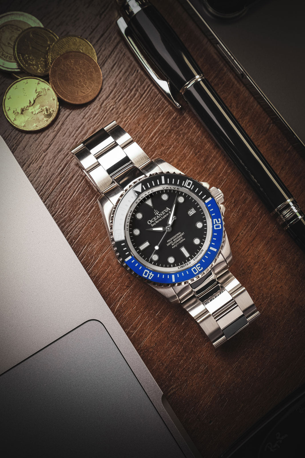 Oceaneva 1250M Dive Watch Blue and Black On Bracelet Wooden Table