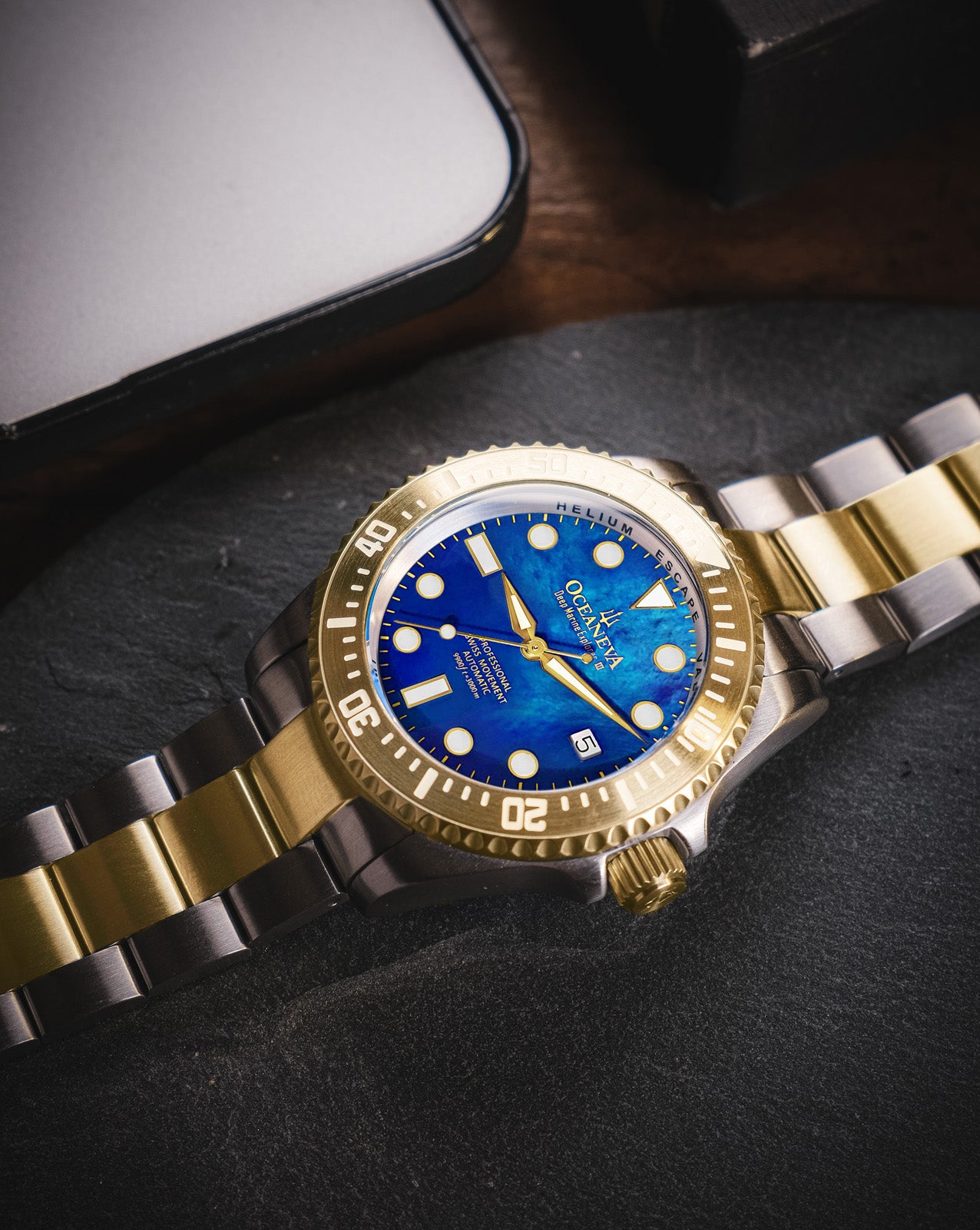 Oceaneva 3000M Dive Watch Blue Mother of Pearl and Gold Lying Flat